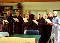 Monks and nuns of Maple Forest Monastery offer a Buddhist chant