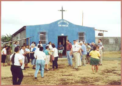 group gathering before the small church