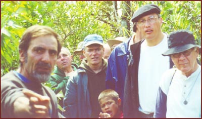 Brother Patricio shows visitors the gardens